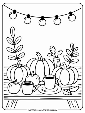 A coloring page featuring pumpkins, apples, and coffee cups on a picnic table, with plants and string lights in the background.